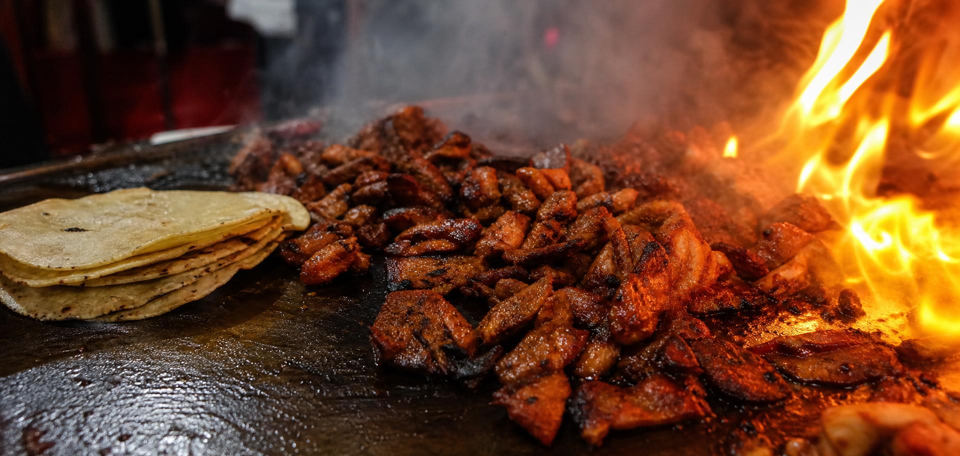 Smoky meats and handmade tortillas on the comal